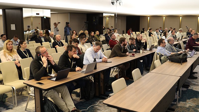 A picture of event attendees listening in on a presentation