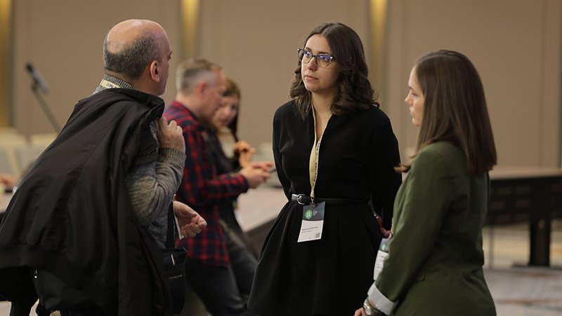 A picture of event attendees networking