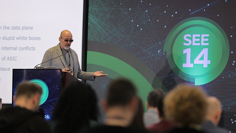 A picture of Oleksiy Alex Semenyaka giving a presentation