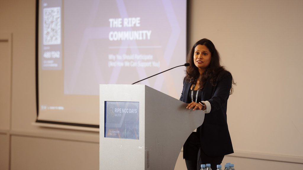 A picture of Ulka Athale giving a presentation