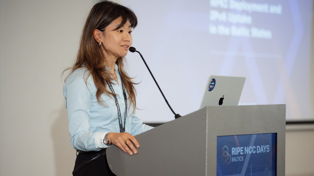 A picture of Anastasiya Pak giving a presentation